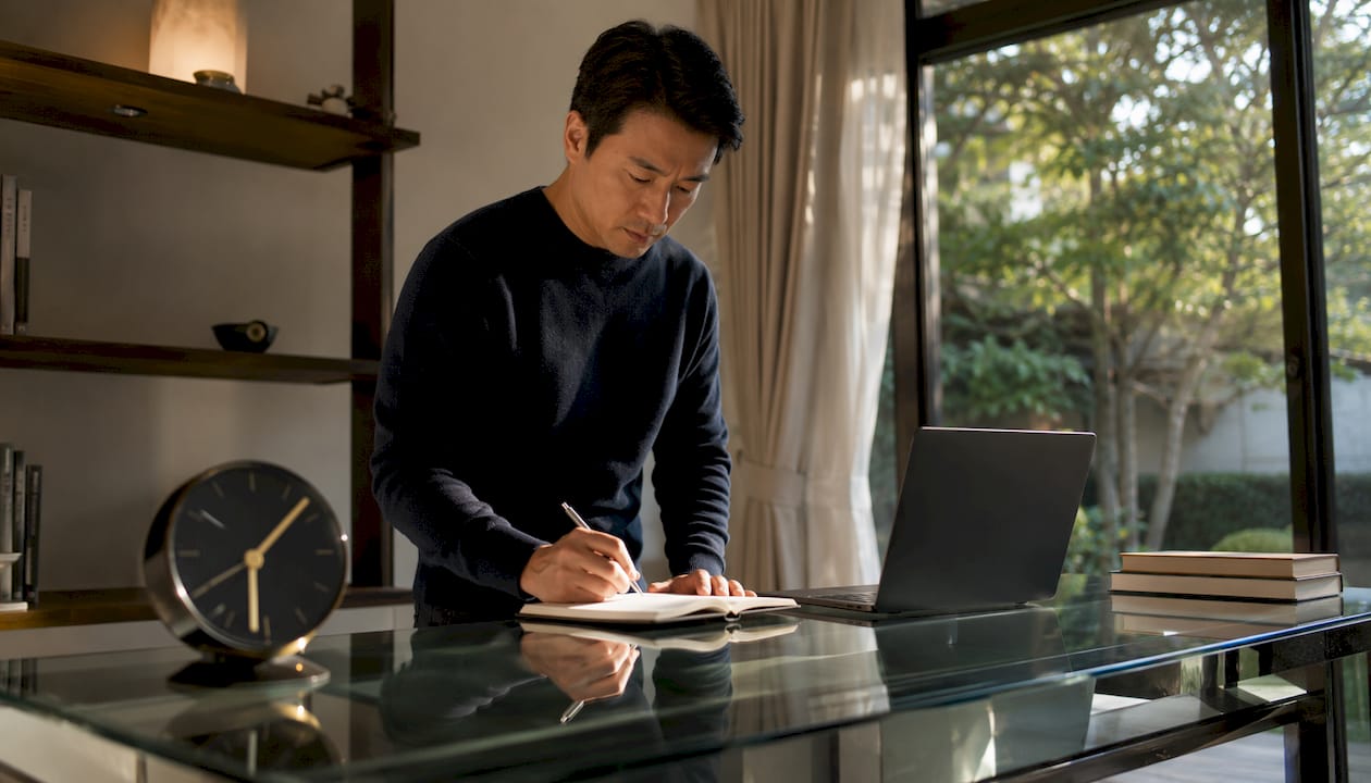 Man planning sales goals at home desk
