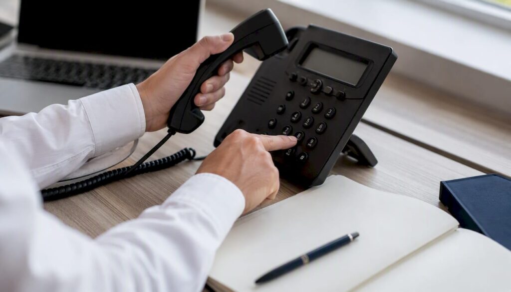 Sales rep hands using phone during call