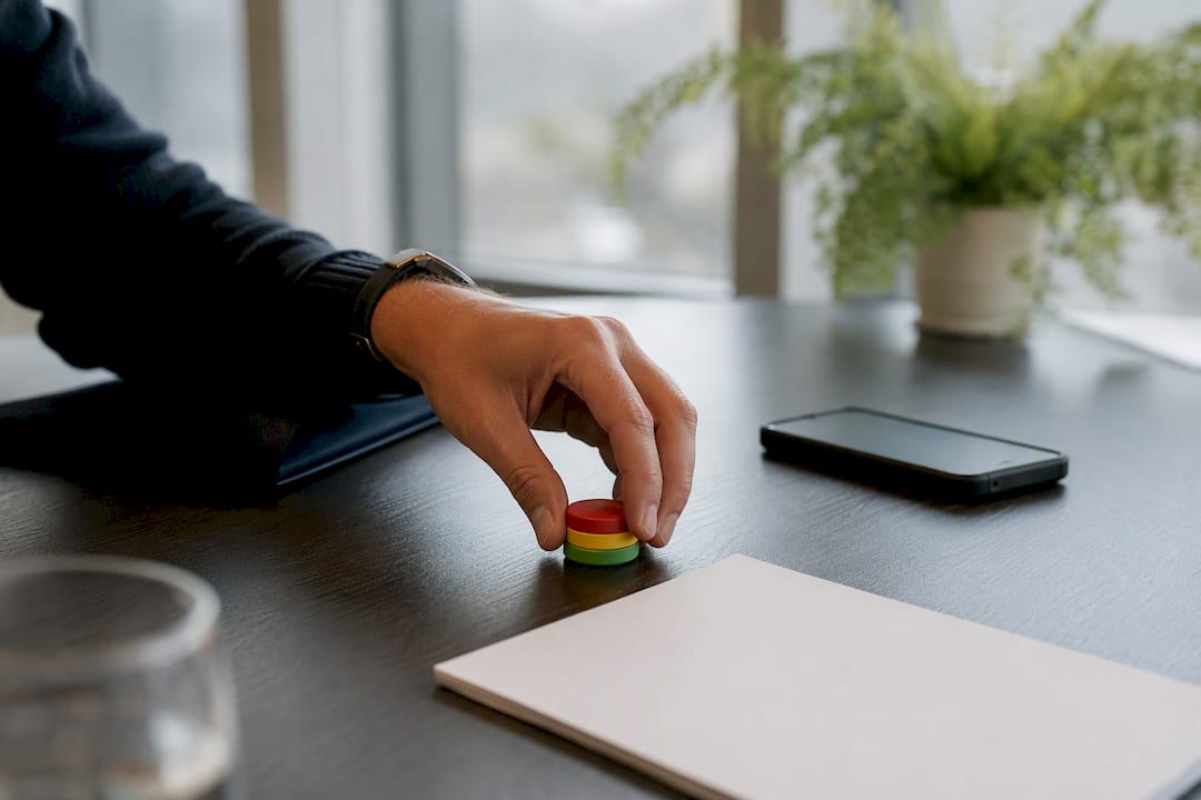 Hand placing decision tokens in a meeting