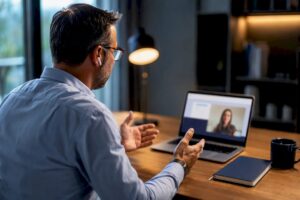 Manager conducting remote sales coaching
