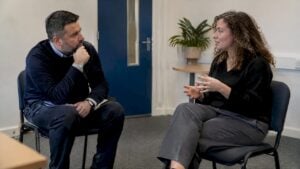 Manager coaching representative during sales rehearsal