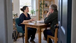 Coach discussing her service with a prospective client