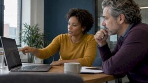 Sales leader and adviser reviewing a call