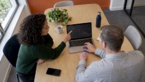 Buyer and consultant co-authoring a shared action plan