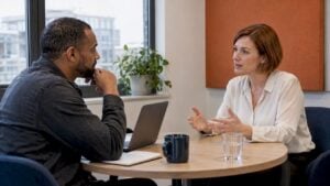Sales trainer listening to a buyer’s concern