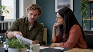 Sales director coaching a representative on a live deal